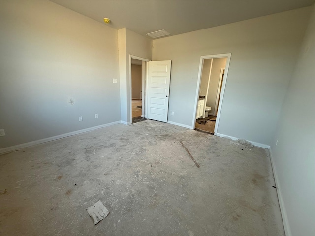 2568 Hawks Eye Dr, Conroe, TX 77301 - unfurnished bedroom featuring connected bathroom and baseboards