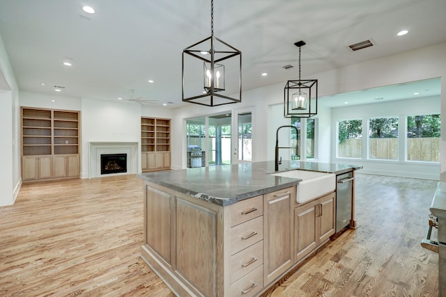 1243 Candlelight Ln, Houston, TX 77018 - kitchen featuring a sink, open floor plan, light wood finished floors, and recessed lighting