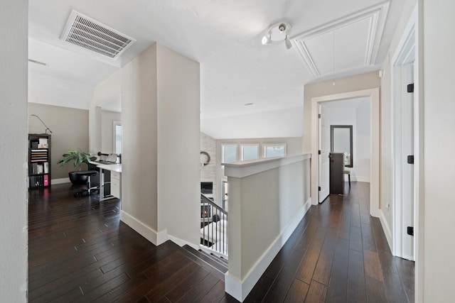 6218 Southcott Ct, Katy, TX 77450 - hallway with attic access, baseboards, an upstairs landing, and dark wood-style floors