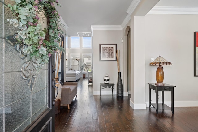 6218 Southcott Ct, Katy, TX 77450 - entrance foyer with arched walkways, dark wood-style floors, baseboards, and crown molding
