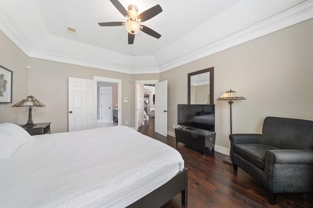6218 Southcott Ct, Katy, TX 77450 - bedroom featuring a raised ceiling, dark wood-style flooring, baseboards, and a ceiling fan