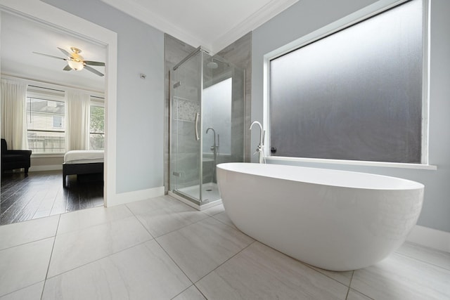 6218 Southcott Ct, Katy, TX 77450 - ensuite bathroom with crown molding, a soaking tub, a stall shower, ceiling fan, and baseboards