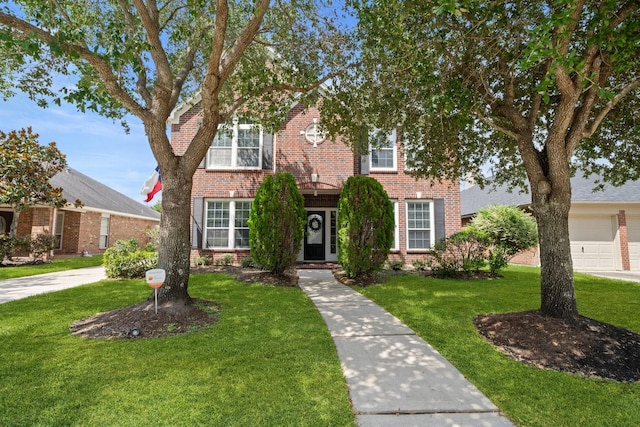 6218 Southcott Ct, Katy, TX 77450 - view of front of home featuring brick siding and a front lawn