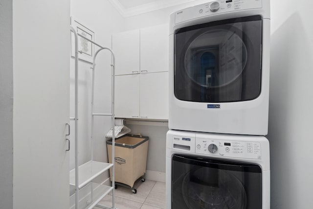 6218 Southcott Ct, Katy, TX 77450 - washroom featuring stacked washer / dryer, cabinet space, and crown molding