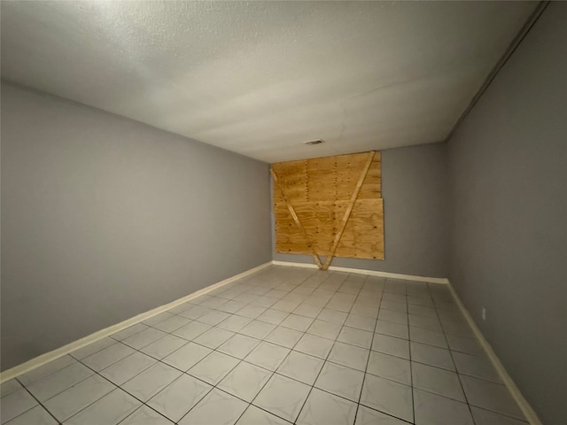 10509 Kelburn Dr, Houston, TX 77016 - unfurnished room featuring baseboards and light tile patterned floors