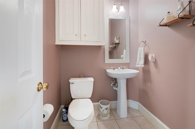 17814 Shady Arbor Way, Spring, TX 77379 - bathroom with baseboards, toilet, tile patterned flooring, and a sink