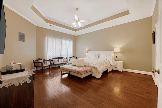 17814 Shady Arbor Way, Spring, TX 77379 - bedroom with a tray ceiling, baseboards, ornamental molding, dark wood-type flooring, and a ceiling fan