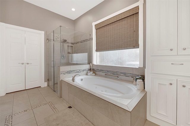 17814 Shady Arbor Way, Spring, TX 77379 - bathroom featuring a shower stall, a whirlpool tub, and tile patterned flooring