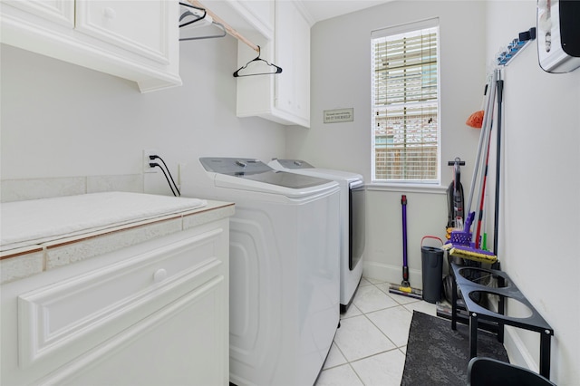 17814 Shady Arbor Way, Spring, TX 77379 - laundry area featuring cabinet space, separate washer and dryer, and light tile patterned flooring