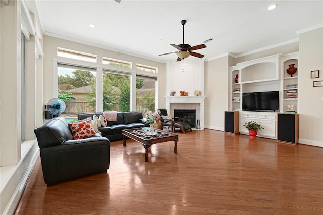17814 Shady Arbor Way, Spring, TX 77379 - living area featuring a ceiling fan, crown molding, wood finished floors, a fireplace, and recessed lighting