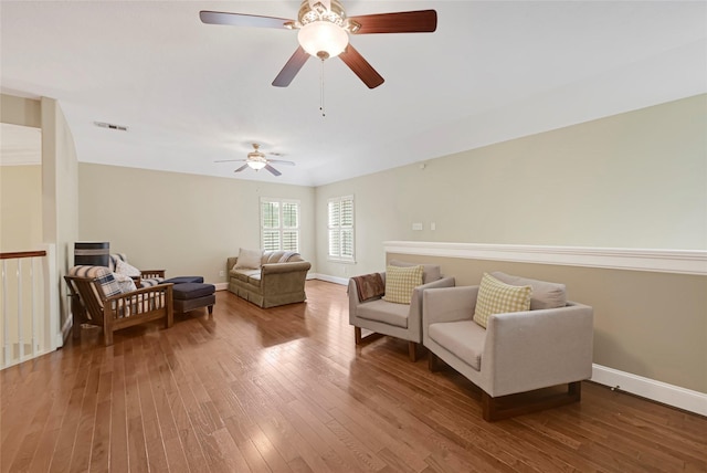 17814 Shady Arbor Way, Spring, TX 77379 - living area featuring hardwood / wood-style floors, baseboards, and a ceiling fan