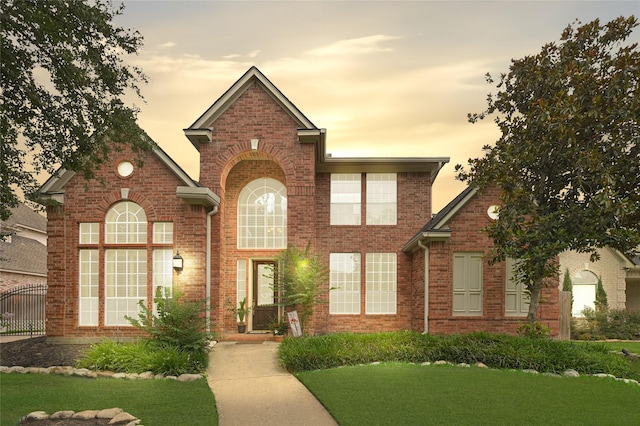 17814 Shady Arbor Way, Spring, TX 77379 - traditional-style house featuring brick siding and a front lawn