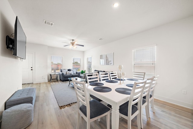3610 Sealy St, Galveston, TX 77550 - dining room with healthy amount of natural light, a ceiling fan, light wood finished floors, and baseboards
