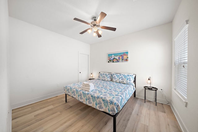 3610 Sealy St, Galveston, TX 77550 - bedroom with multiple windows, light wood-type flooring, and baseboards
