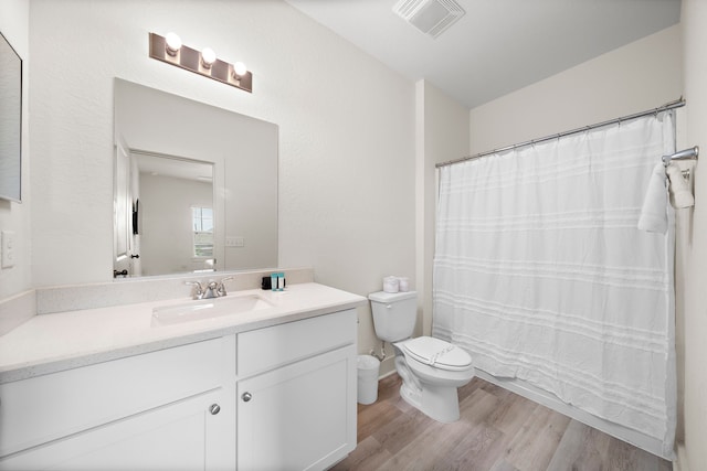 3610 Sealy St, Galveston, TX 77550 - bathroom with toilet, wood finished floors, and vanity