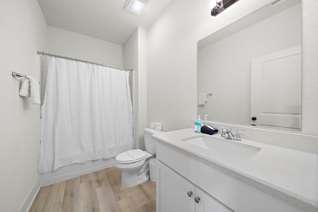 3610 Sealy St, Galveston, TX 77550 - bathroom featuring vanity, wood finished floors, toilet, and shower / bath combo