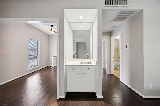 726 Bering Dr Unit F, Houston, TX 77057 - corridor featuring a sink and dark wood-type flooring