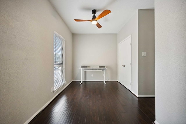 726 Bering Dr Unit F, Houston, TX 77057 - empty room featuring a ceiling fan and dark wood-style flooring
