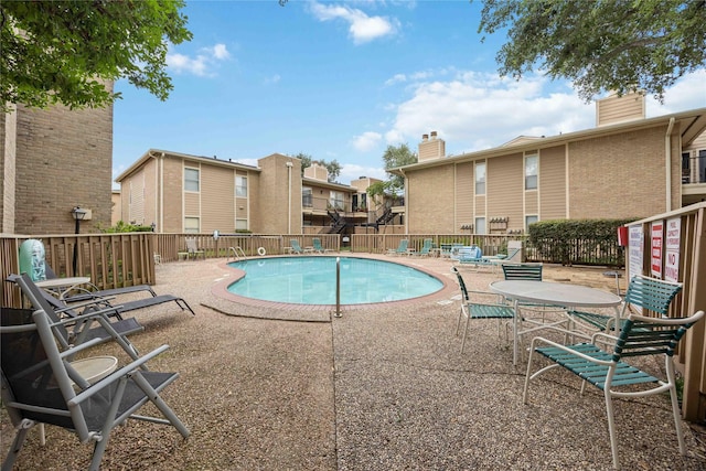 726 Bering Dr Unit F, Houston, TX 77057 - community pool with a patio and a residential view