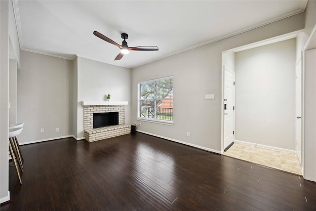 726 Bering Dr Unit F, Houston, TX 77057 - unfurnished living room with a ceiling fan, ornamental molding, wood finished floors, and a brick fireplace