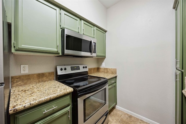 726 Bering Dr Unit F, Houston, TX 77057 - kitchen with green cabinets, appliances with stainless steel finishes, and light countertops