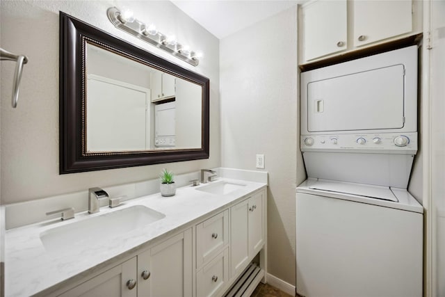 726 Bering Dr Unit F, Houston, TX 77057 - bathroom featuring stacked washing machine and dryer and double vanity