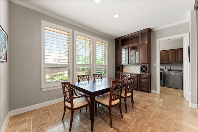 74 Spincaster Dr, Spring, TX 77389 - dining space with ornamental molding, independent washer and dryer, stone tile floors, and recessed lighting