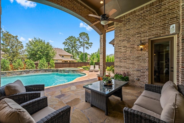 74 Spincaster Dr, Spring, TX 77389 - fenced backyard with ceiling fan, an outdoor hangout area, a patio, and an in-ground hot tub