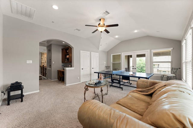 74 Spincaster Dr, Spring, TX 77389 - carpeted living room with french doors, ceiling fan, lofted ceiling, recessed lighting, and arched walkways