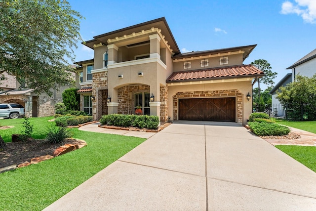 74 Spincaster Dr, Spring, TX 77389 - mediterranean / spanish home featuring stone siding, stucco siding, concrete driveway, and a front yard