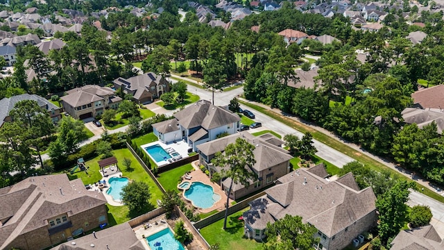 74 Spincaster Dr, Spring, TX 77389 - aerial overview of property's location with a pool and nearby suburban area
