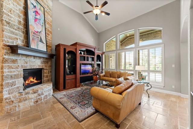 74 Spincaster Dr, Spring, TX 77389 - living area with high vaulted ceiling, stone tile floors, ornamental molding, a fireplace, and plenty of natural light