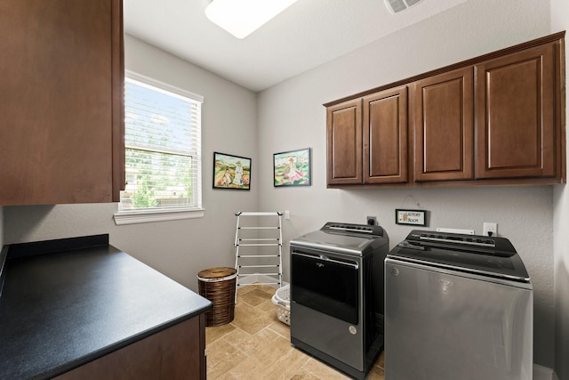 74 Spincaster Dr, Spring, TX 77389 - washroom with cabinet space, washing machine and clothes dryer, and light stone finish flooring
