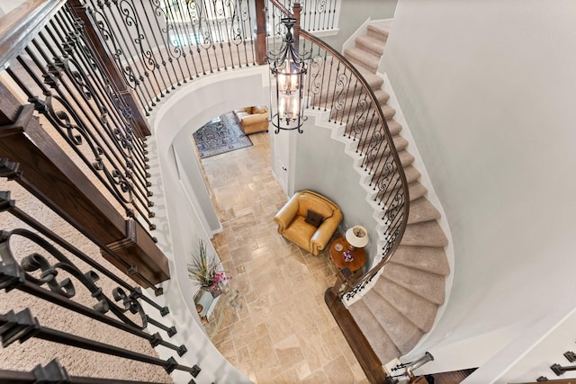 74 Spincaster Dr, Spring, TX 77389 - stairs featuring stone tile floors and a high ceiling