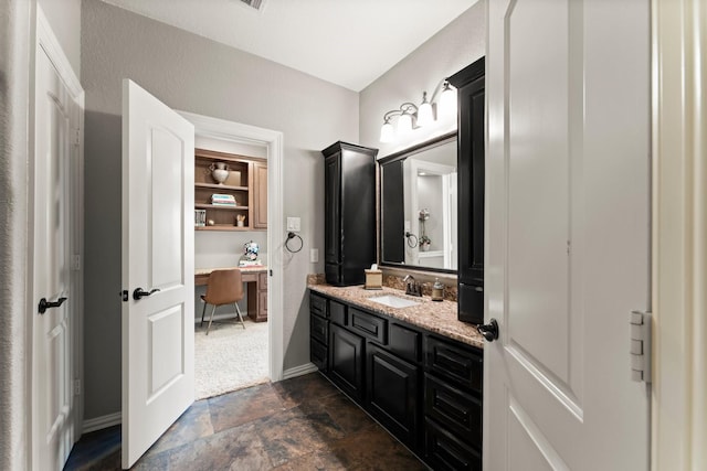 74 Spincaster Dr, Spring, TX 77389 - bathroom featuring stone finish floors and vanity