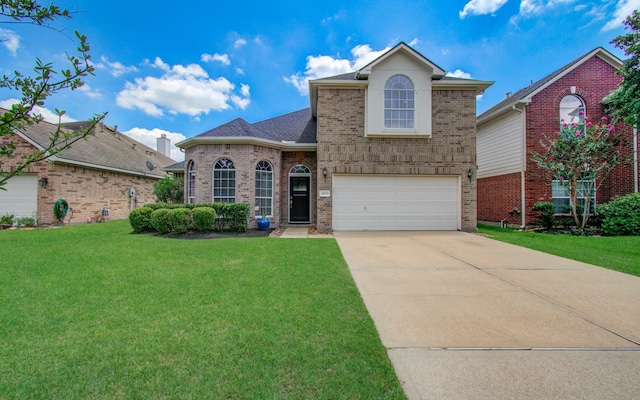 12807 Sienna Trails Dr, Tomball, TX 77377 - traditional-style house featuring brick siding, driveway, a front lawn, and a garage