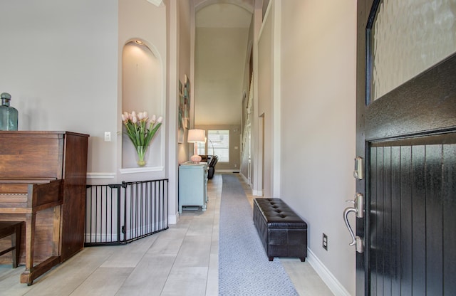 12807 Sienna Trails Dr, Tomball, TX 77377 - hallway with a towering ceiling and light wood-style flooring