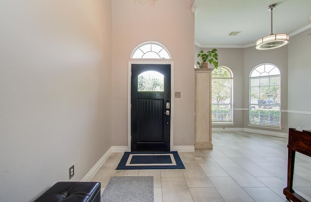 12807 Sienna Trails Dr, Tomball, TX 77377 - entryway featuring healthy amount of natural light, baseboards, and crown molding