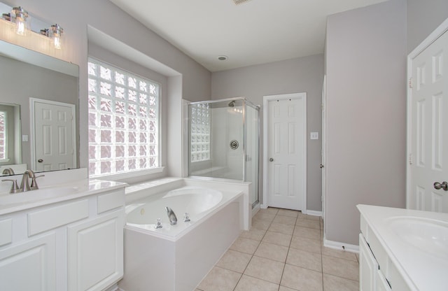 12807 Sienna Trails Dr, Tomball, TX 77377 - bathroom with two vanities, a stall shower, a bath, and tile patterned flooring