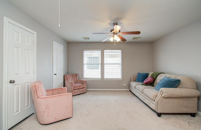 12807 Sienna Trails Dr, Tomball, TX 77377 - carpeted living room with a ceiling fan, baseboards, and attic access