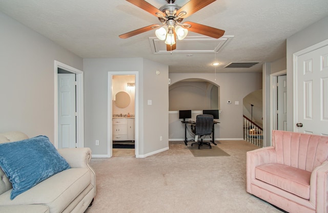 12807 Sienna Trails Dr, Tomball, TX 77377 - living room featuring attic access, an office area, a ceiling fan, carpet flooring, and baseboards