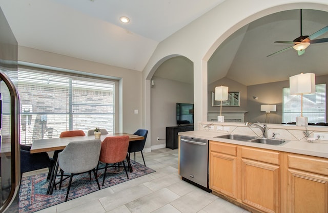 12807 Sienna Trails Dr, Tomball, TX 77377 - kitchen with stainless steel dishwasher, a sink, vaulted ceiling, healthy amount of natural light, and ceiling fan