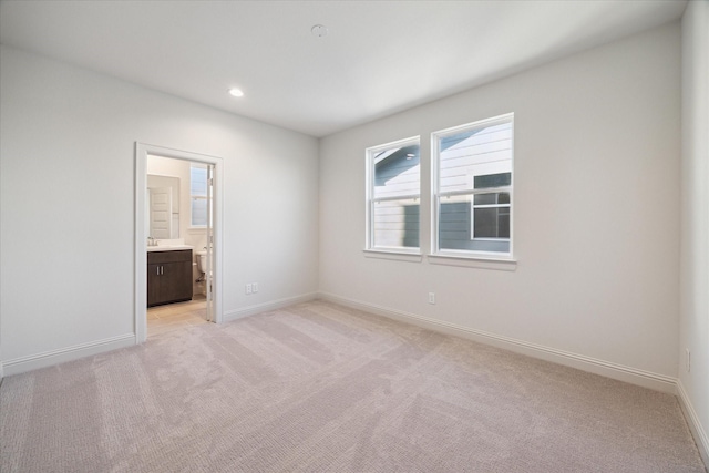 1805 Mills St, Houston, TX 77026 - unfurnished room with light colored carpet, baseboards, and recessed lighting