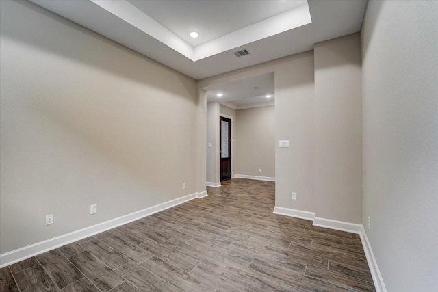 7563 Congress Trail Way, Porter, TX 77365 - unfurnished room with baseboards, wood finished floors, recessed lighting, and a raised ceiling