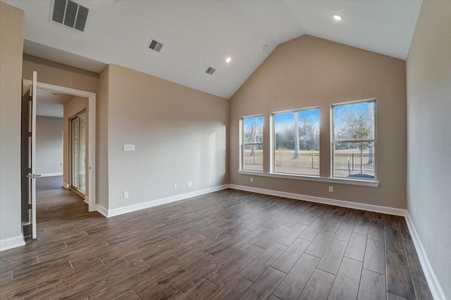 7563 Congress Trail Way, Porter, TX 77365 - unfurnished room with dark wood finished floors, baseboards, recessed lighting, and high vaulted ceiling
