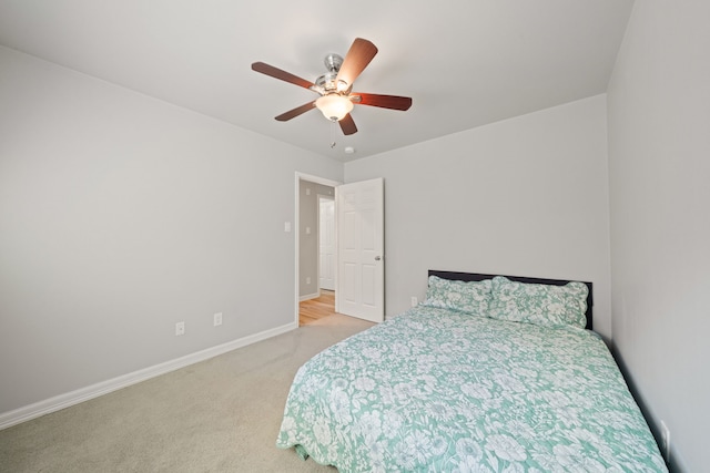 146 S Star Ridge Cir, The Woodlands, TX 77382 - bedroom with carpet floors, a ceiling fan, and baseboards
