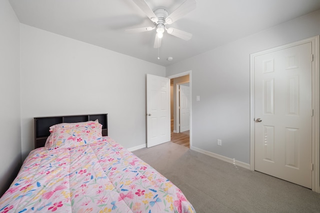 146 S Star Ridge Cir, The Woodlands, TX 77382 - bedroom featuring carpet, baseboards, and ceiling fan