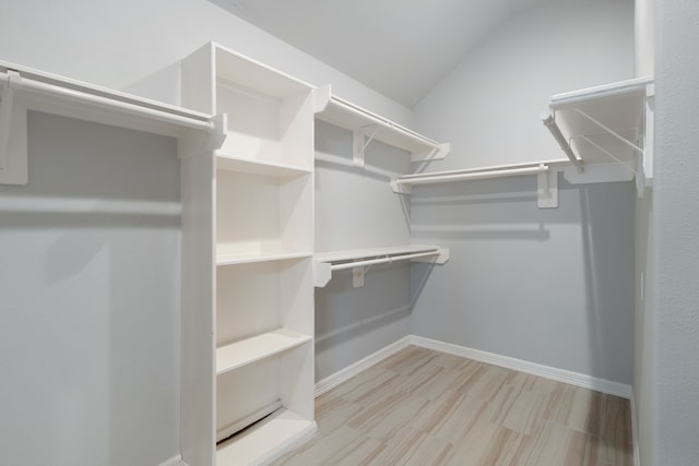 146 S Star Ridge Cir, The Woodlands, TX 77382 - spacious closet with wood finished floors and lofted ceiling