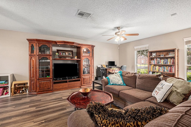 1826 Concho River Ct, Sugar Land, TX 77478 - living area with wood finished floors, a ceiling fan, a desk, and a textured ceiling