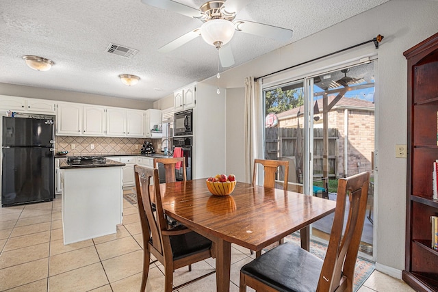 1826 Concho River Ct, Sugar Land, TX 77478 - dining room with a textured ceiling, light tile patterned flooring, and ceiling fan